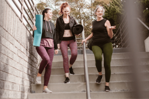 Three women exercising to lessen symptoms of living with PCOS